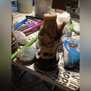 Ornate Figurine on Dark Base